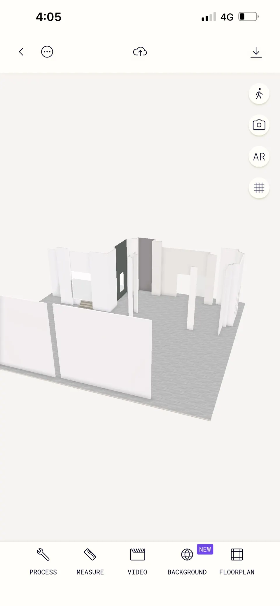 Captura de pantalla en un celular de un escaneo 3D de una sala blanca vacía.